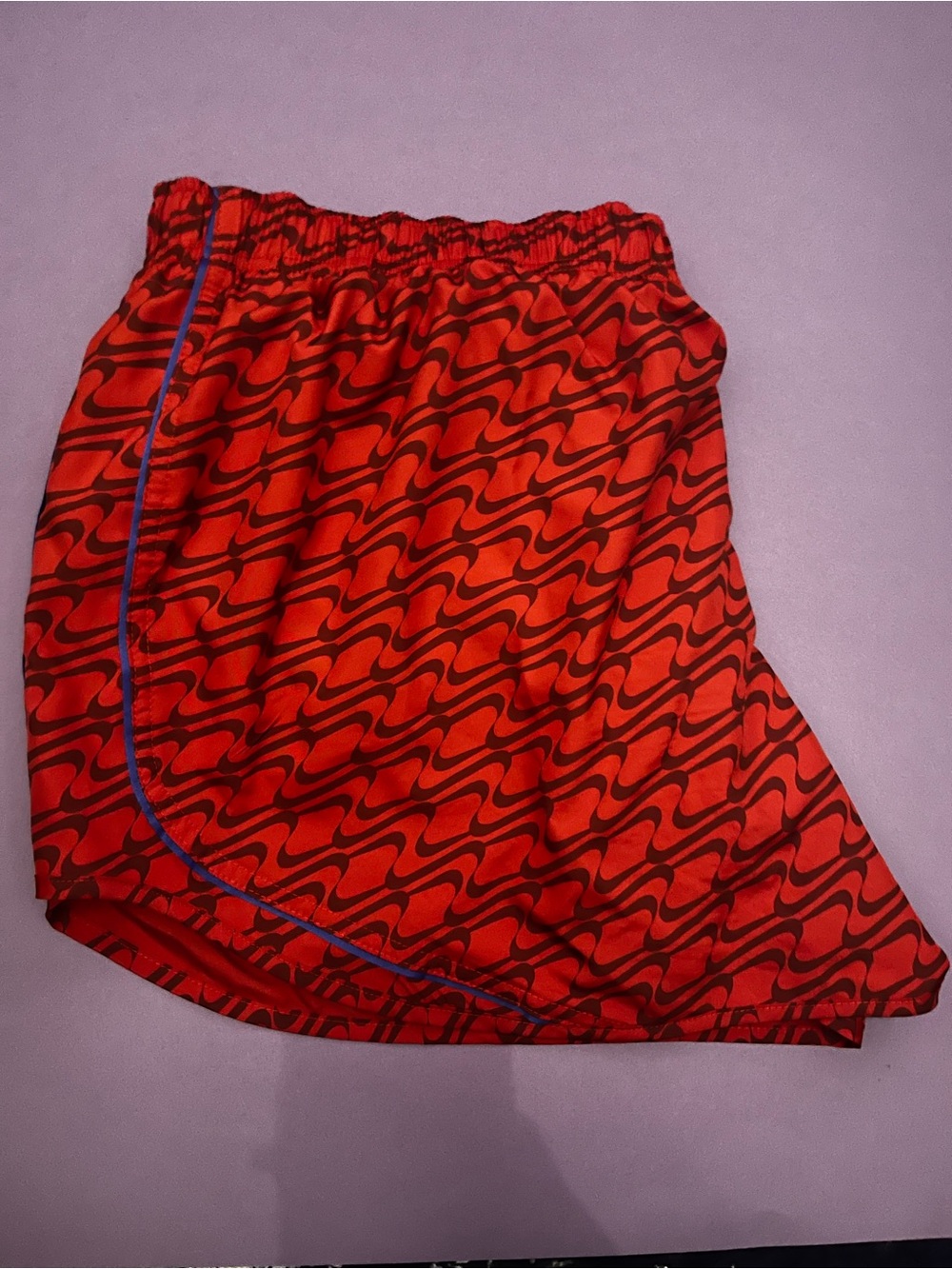 Nike Red orange Athletic Shorts with Black Wave Print and Blue Trim